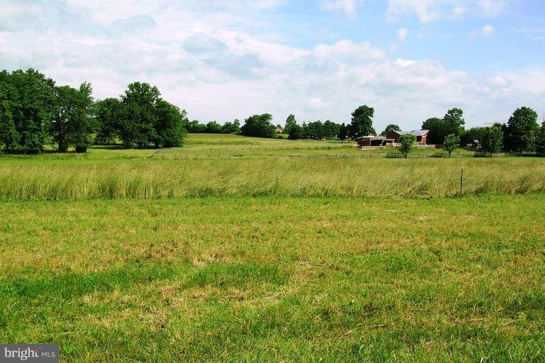 12914 Detour Road Keymar, MD 21757 - Photo 1 of 18 a view of a lake with a big yard