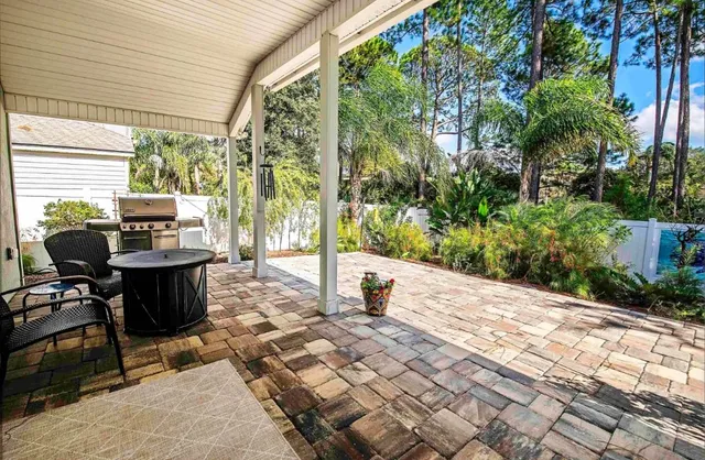 a view of patio with couple of couch