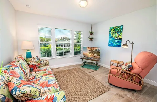 a living room with furniture and a large window