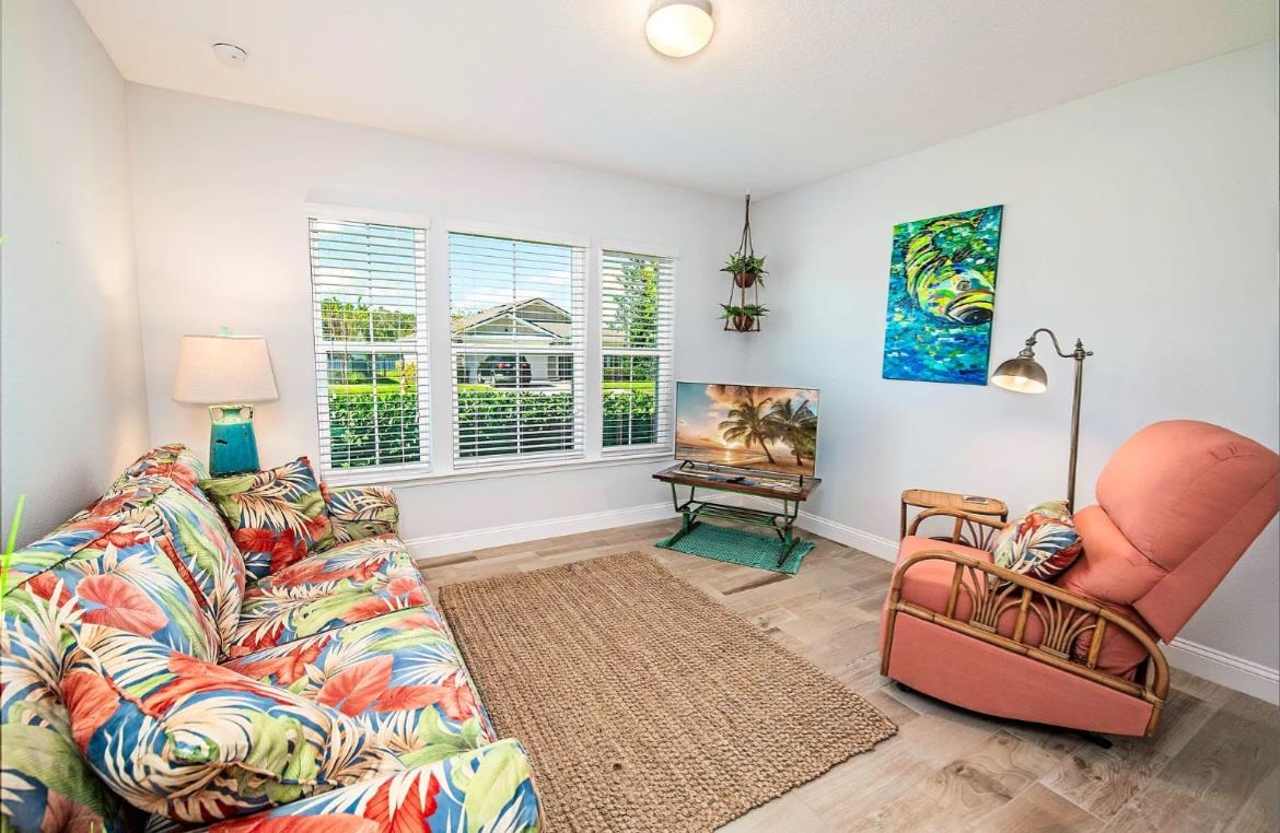 249 Lost Lake Drive St. Augustine, FL 32086 - Photo 19 of 22 a living room with furniture and a large window