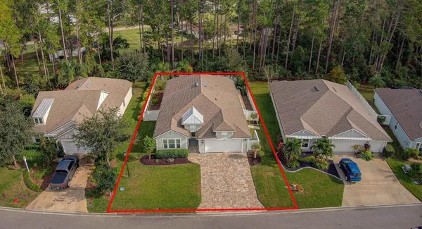 an aerial view of a house with a swimming pool