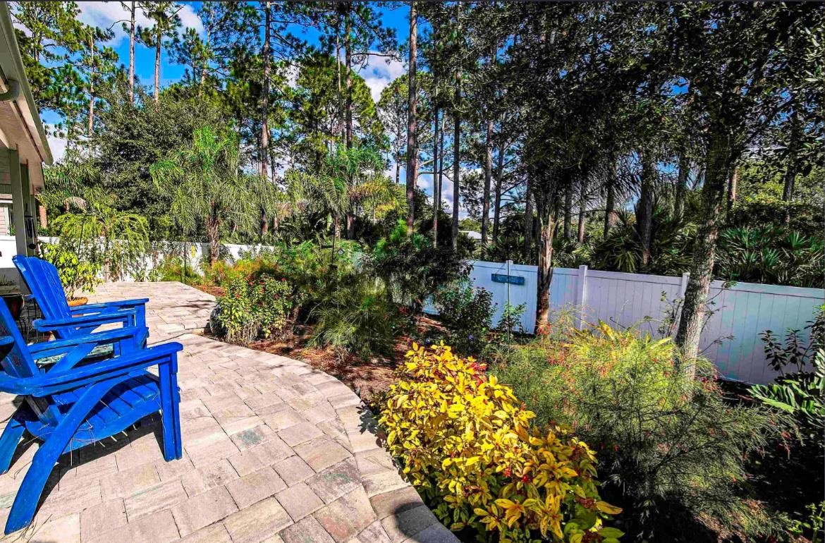 249 Lost Lake Drive St. Augustine, FL 32086 - Photo 21 of 22 a view of a chair and table in the garden