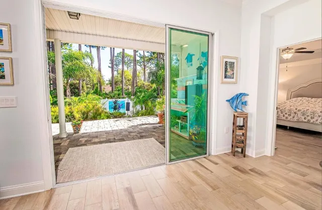 a view of livingroom with furniture and floor to ceiling window
