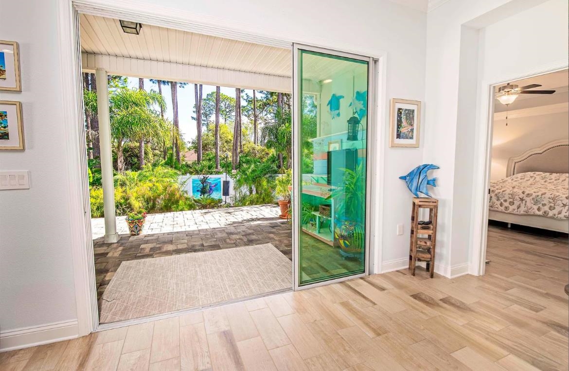 249 Lost Lake Drive St. Augustine, FL 32086 - Photo 9 of 22 a view of livingroom with furniture and floor to ceiling window