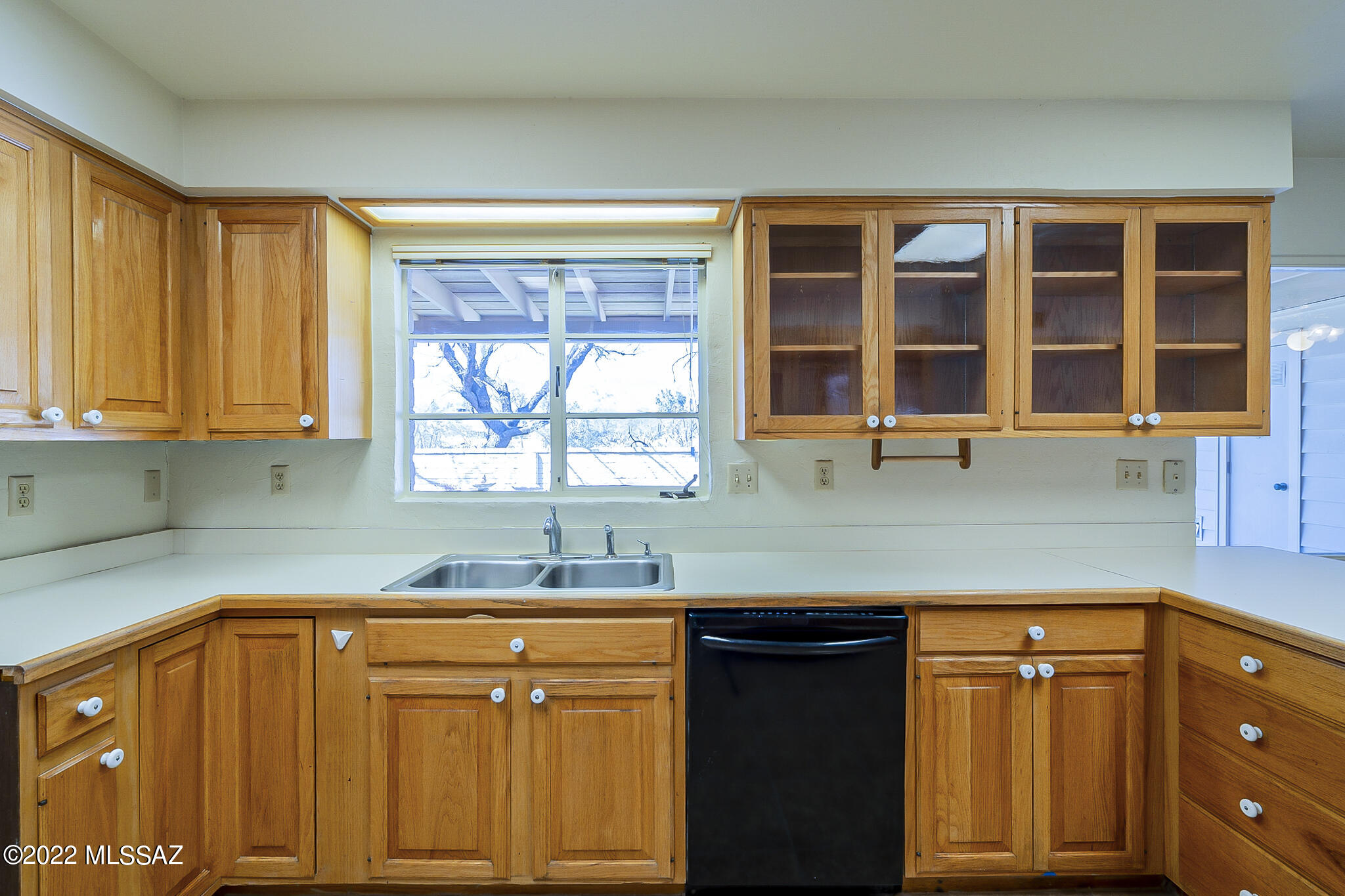 8951 East Bears Path Road Tucson, AZ 85749 - Photo 14 of 41 a kitchen with a sink cabinets and window