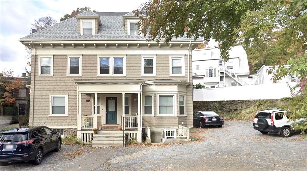 11 Lanark Road, Unit 1 Brookline, MA 02445 - Photo 1 of 11 a car parked in front of a building