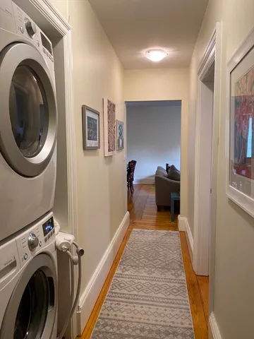 a view of a hallway with washer and dryer