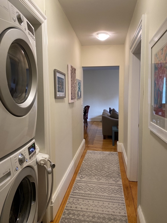 11 Lanark Road, Unit 1 Brookline, MA 02445 - Photo 6 of 11 a view of a hallway with washer and dryer