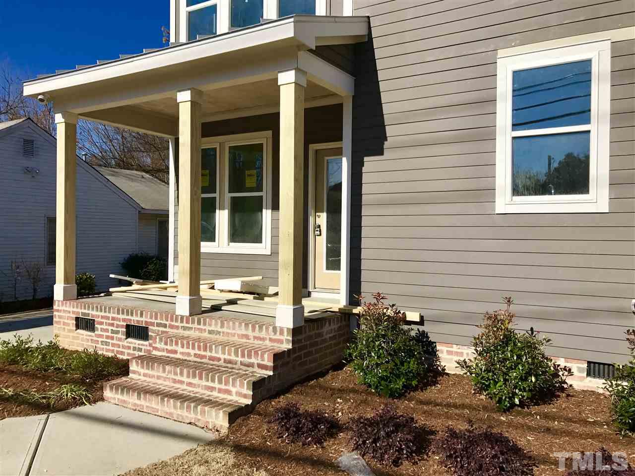 809 East Lenoir Street Raleigh, NC 27601 - Photo 2 of 20 a front view of a house with a yard