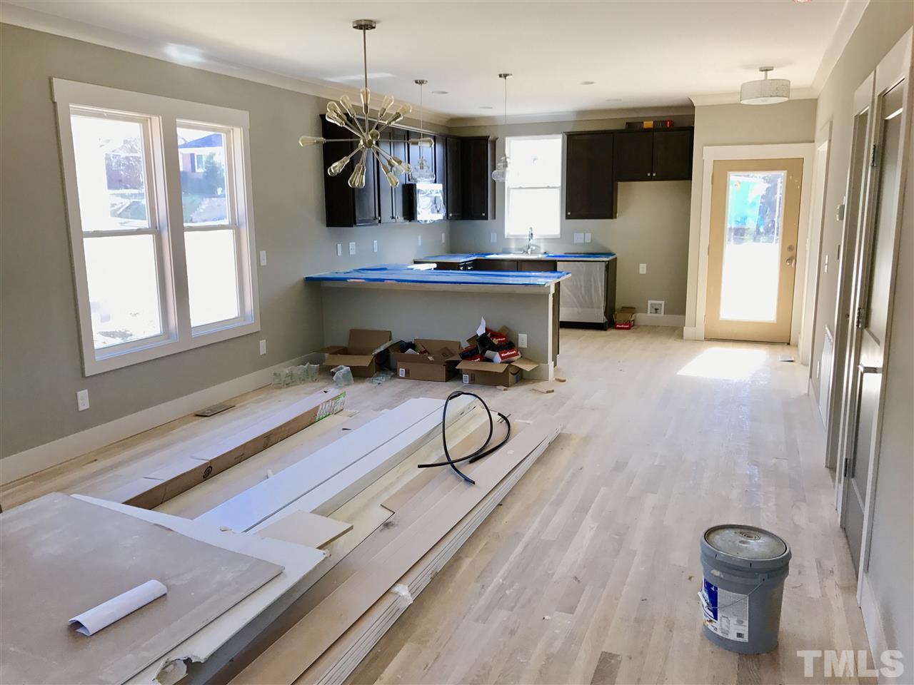 809 East Lenoir Street Raleigh, NC 27601 - Photo 7 of 20 a room with wooden floor and furniture