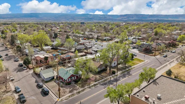 an aerial view of residential houses with outdoor space