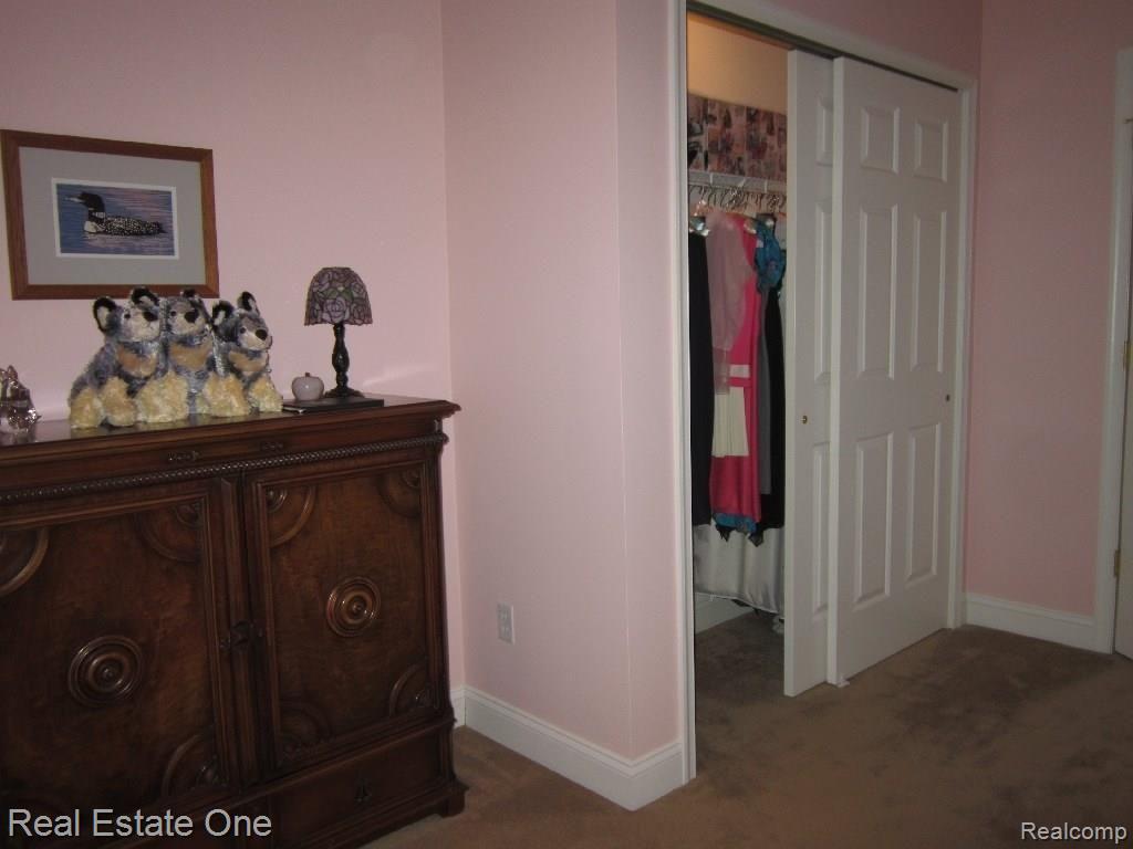 24983 Reeds Pointe Drive, Unit 2 Novi, MI 48374 - Photo 33 of 42 bed 2 to closet - Copy.jpg