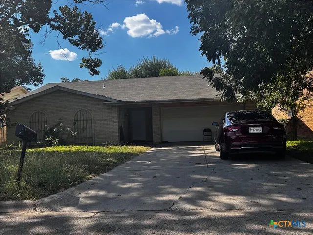a car parked in front of a house