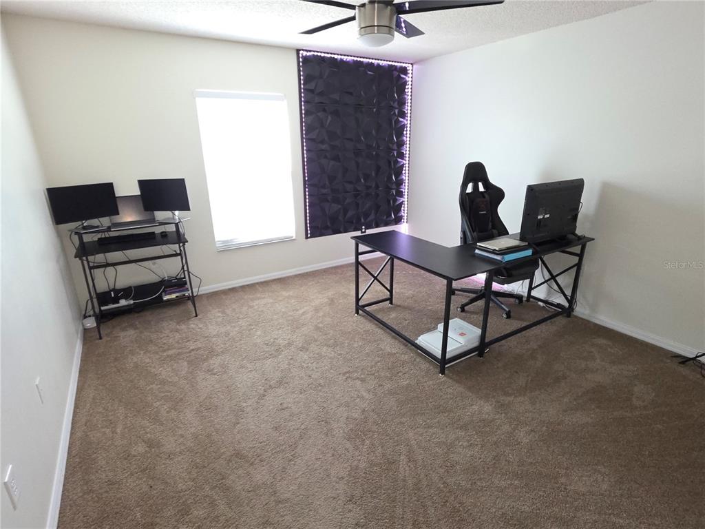 8388 Maltby Road Spring Hill, FL 34606 - Photo 18 of 28 a living room with furniture and a window