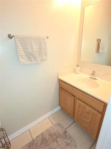 a bathroom with a sink a vanity and a mirror