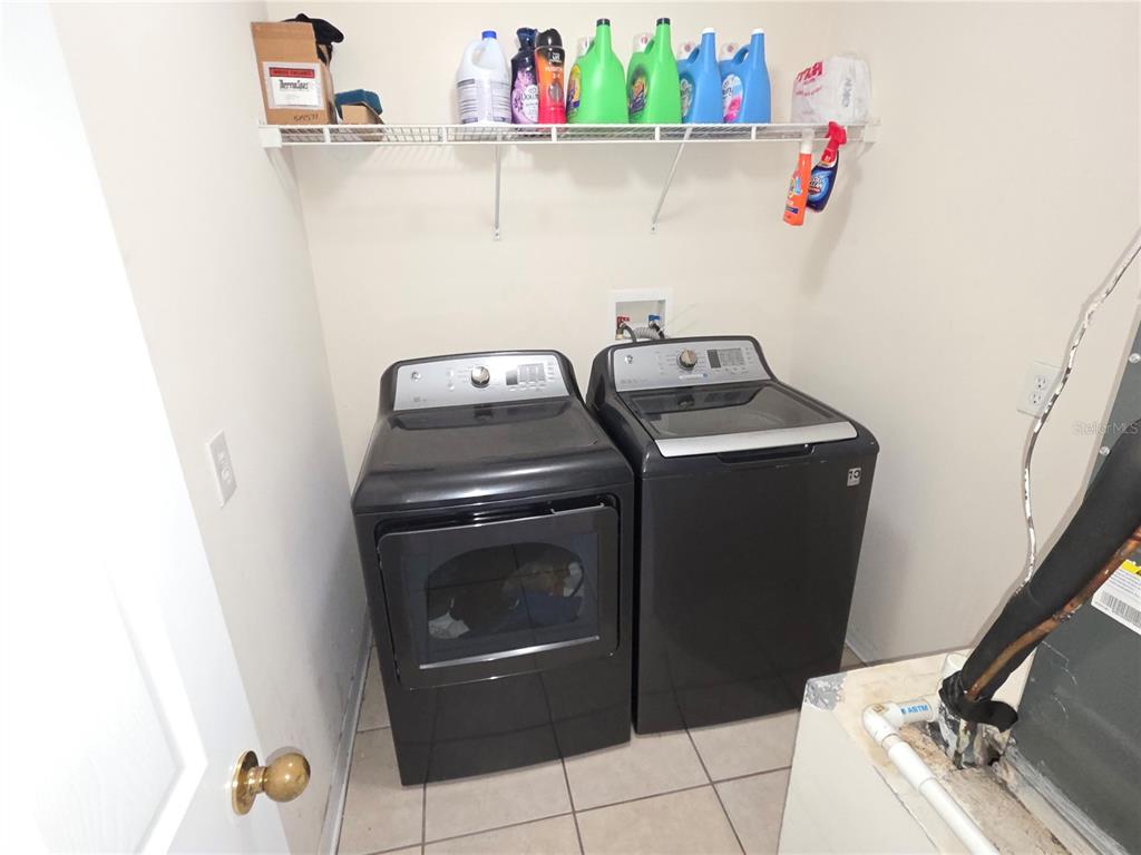 8388 Maltby Road Spring Hill, FL 34606 - Photo 10 of 28 a utility room with dryer and washer
