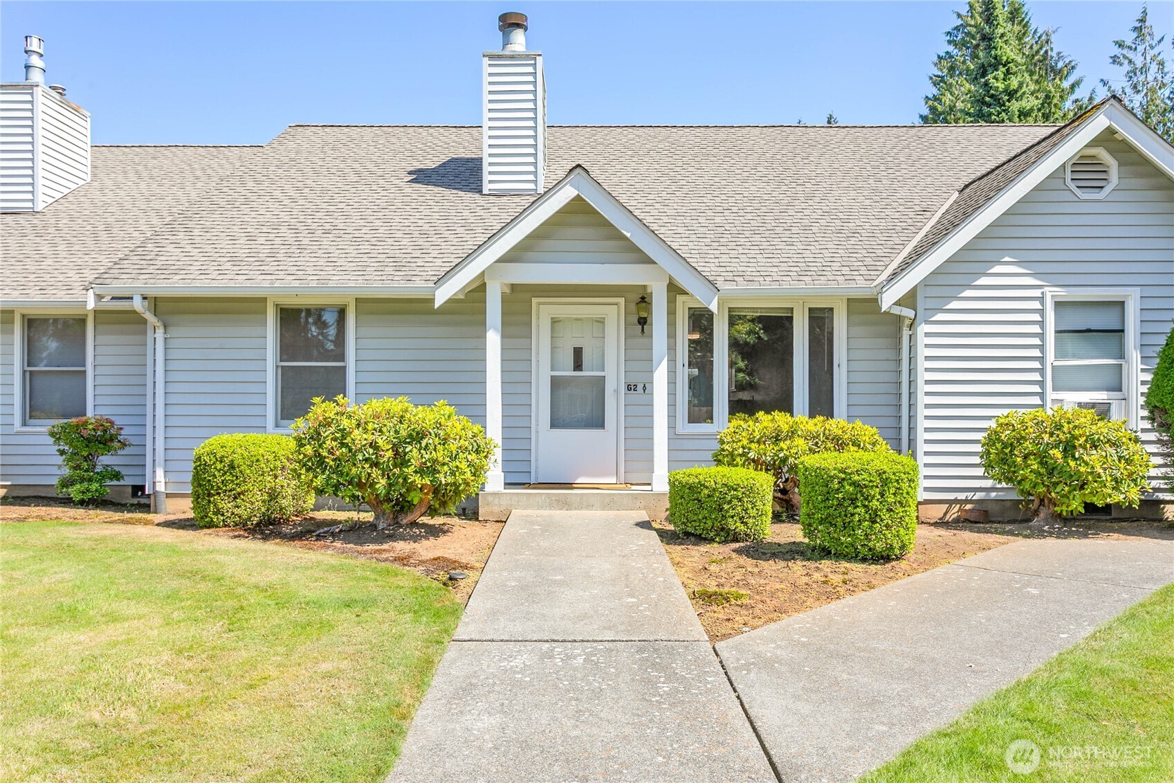 1843 Main Street, Unit G2 Lynden, WA 98264 - Photo 1 of 30 a view of house with outdoor space and garden