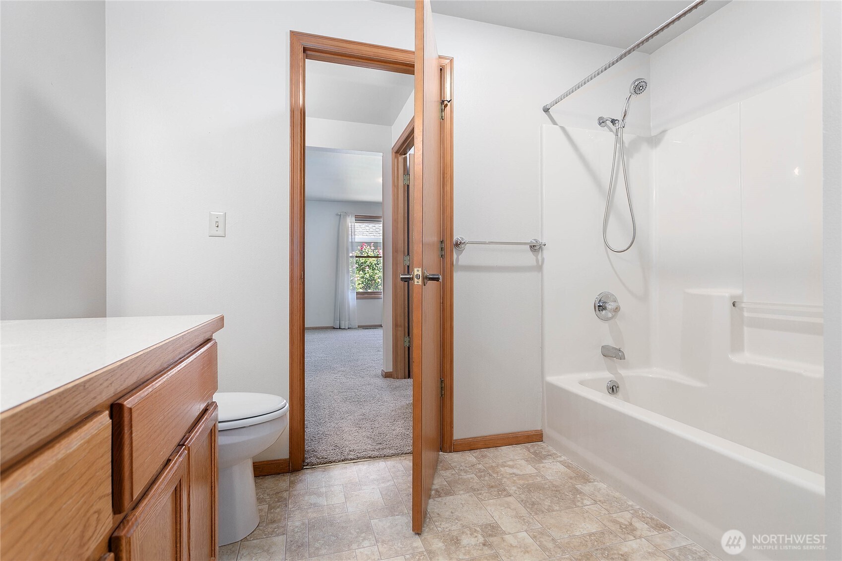 1843 Main Street, Unit G2 Lynden, WA 98264 - Photo 15 of 30 a bathroom with a bathtub a sink a vanity and a shower