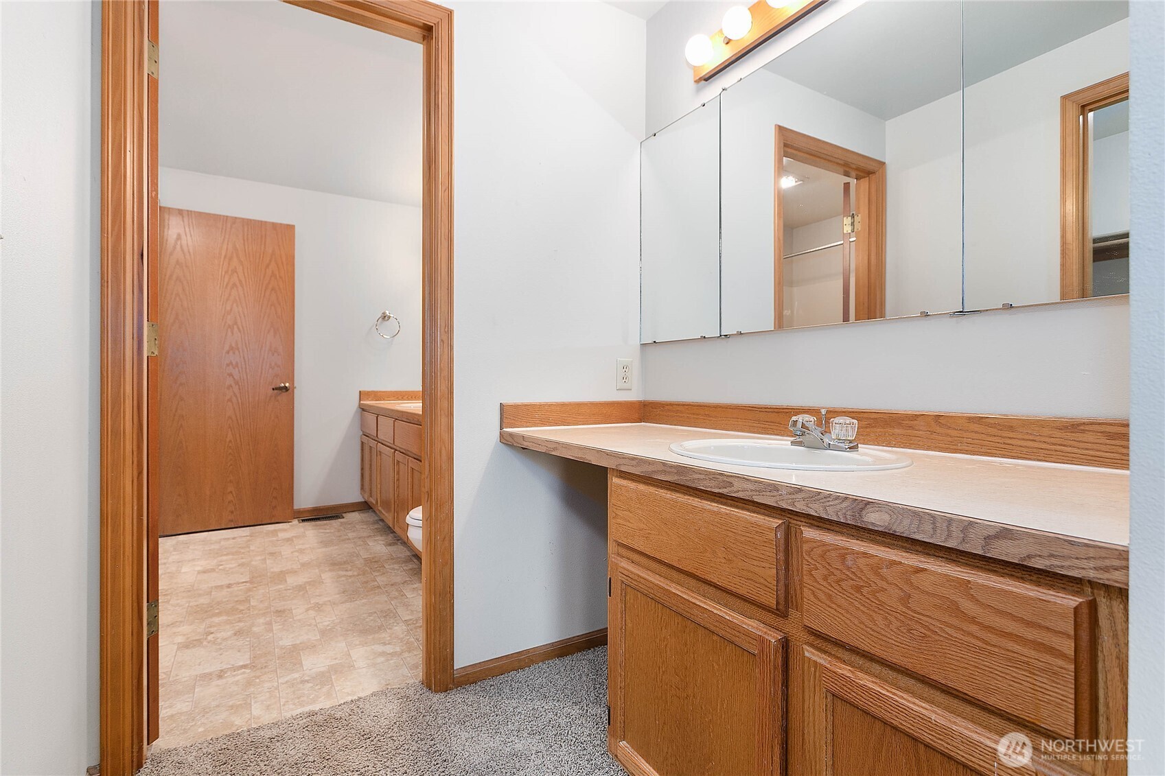 1843 Main Street, Unit G2 Lynden, WA 98264 - Photo 16 of 30 a bathroom with a sink and a mirror