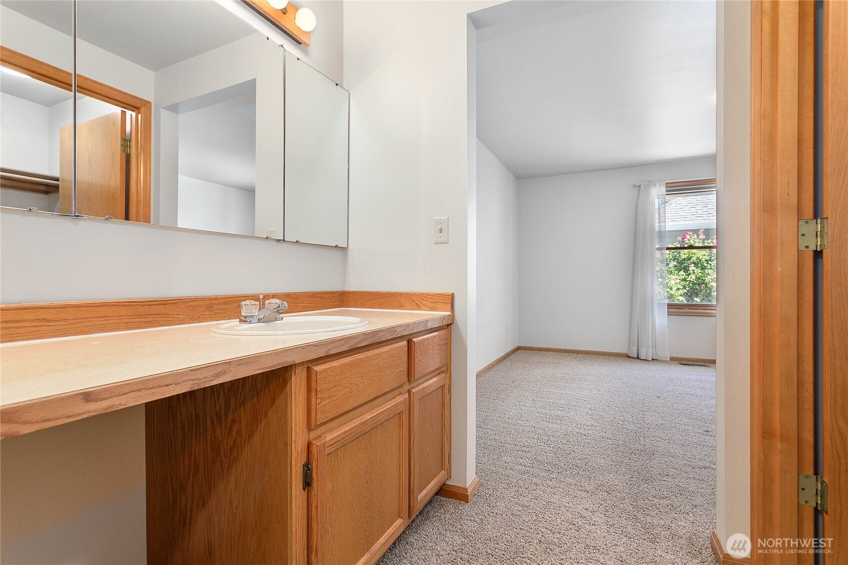 1843 Main Street, Unit G2 Lynden, WA 98264 - Photo 17 of 30 a bathroom with a sink and a mirror