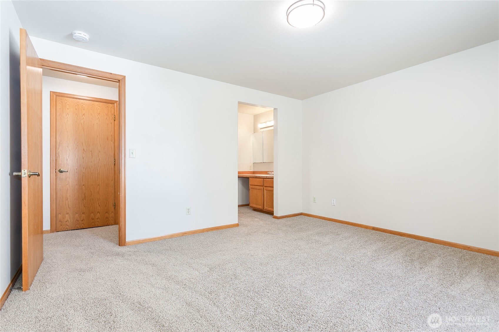1843 Main Street, Unit G2 Lynden, WA 98264 - Photo 19 of 30 an empty room with closet and mirror