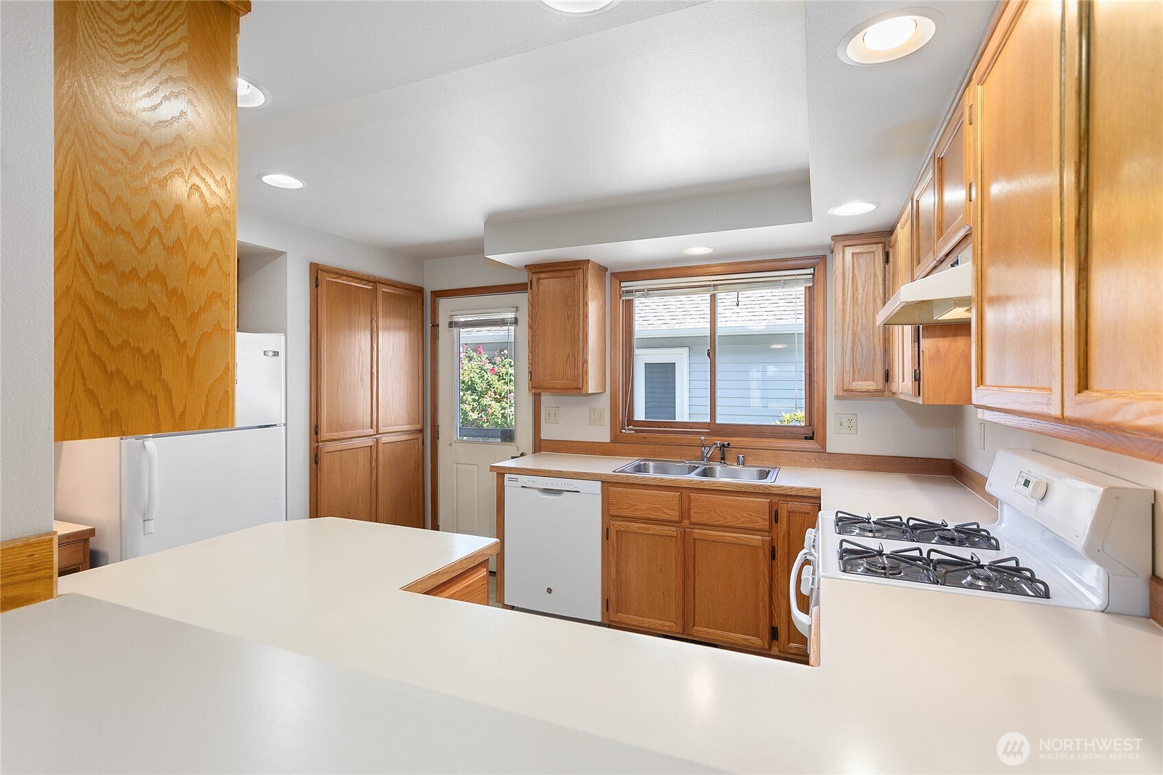 1843 Main Street, Unit G2 Lynden, WA 98264 - Photo 6 of 30 a kitchen with stainless steel appliances granite countertop a sink stove and refrigerator
