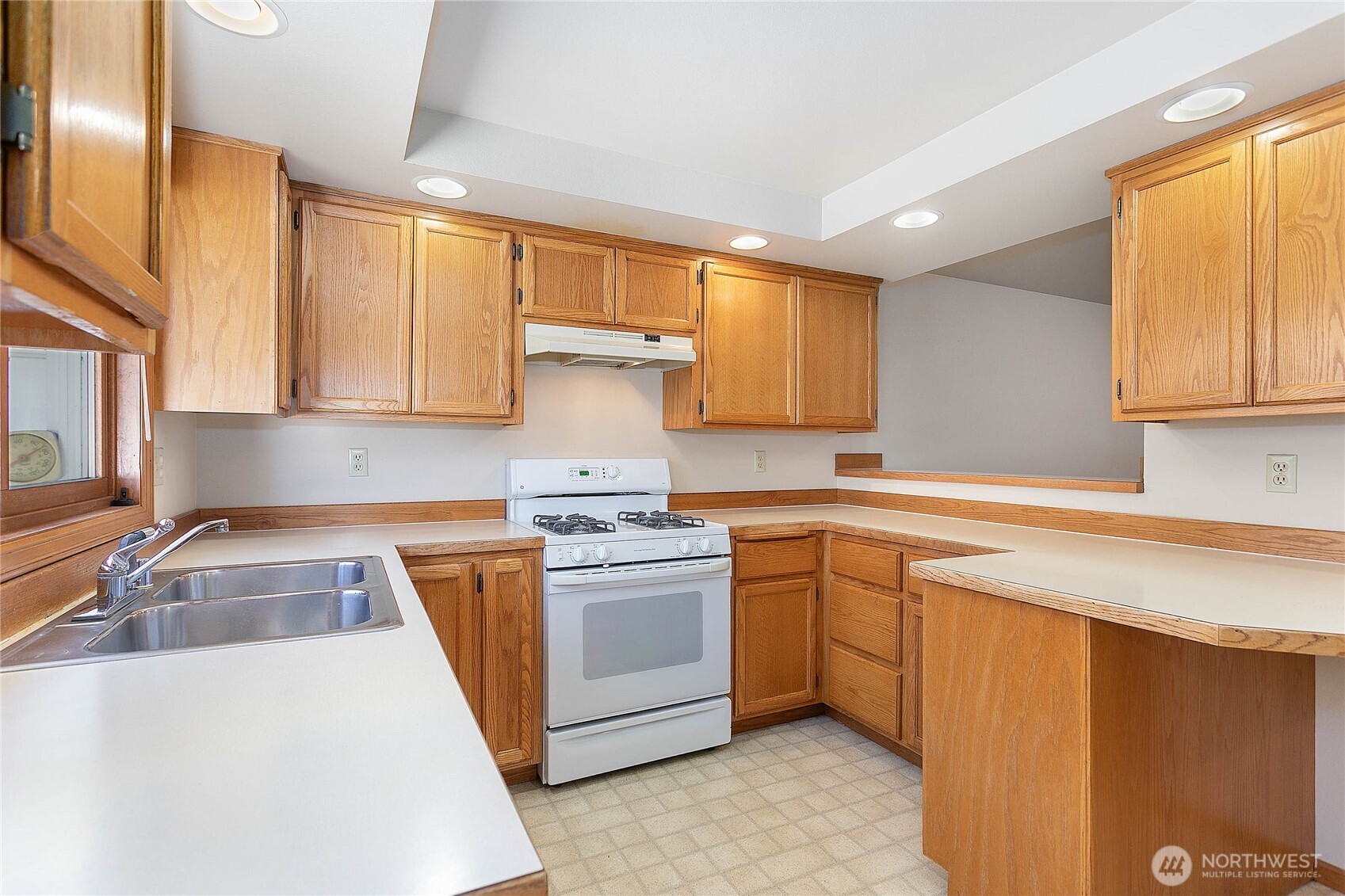 1843 Main Street, Unit G2 Lynden, WA 98264 - Photo 8 of 30 a kitchen with stainless steel appliances granite countertop a sink stove and refrigerator