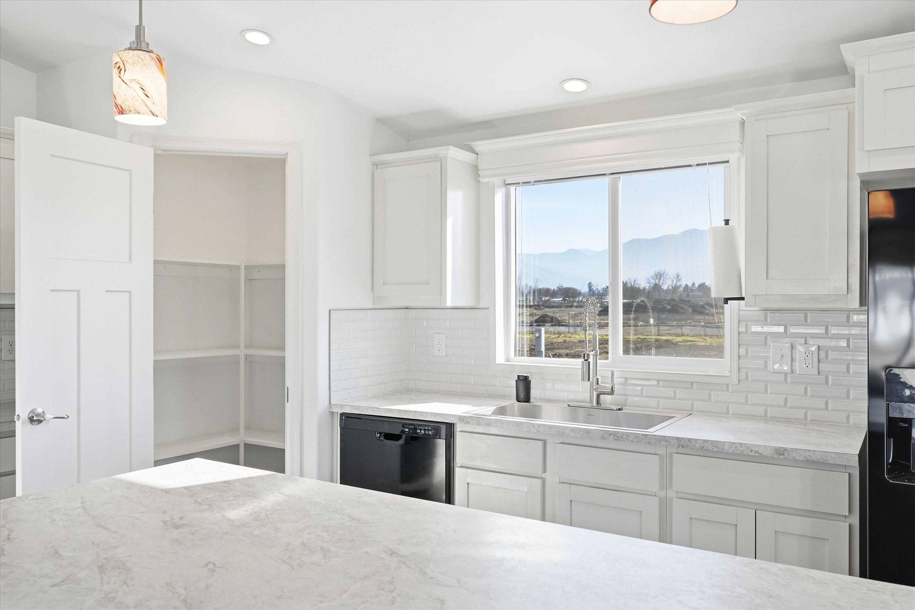 300 Luman Road, Unit 197 Phoenix, OR 97535 - Photo 7 of 26 a kitchen with a sink and large window