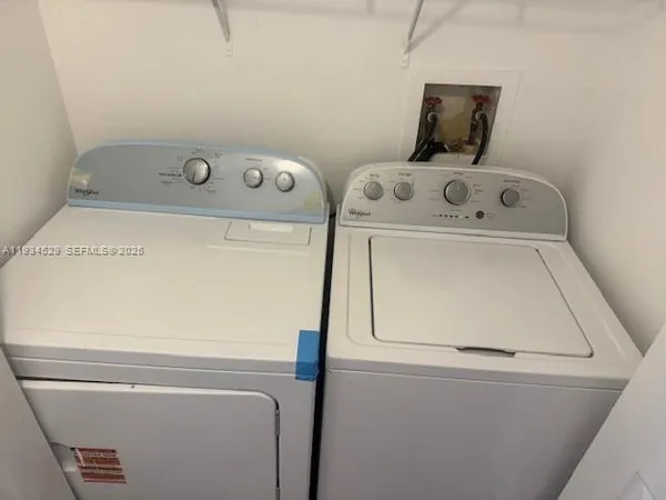 a utility room with dryer and washer