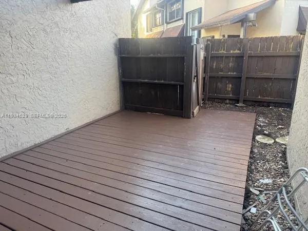 a view of outdoor space and wooden deck