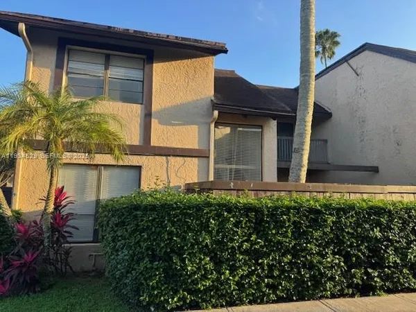 front view of a house with a small yard