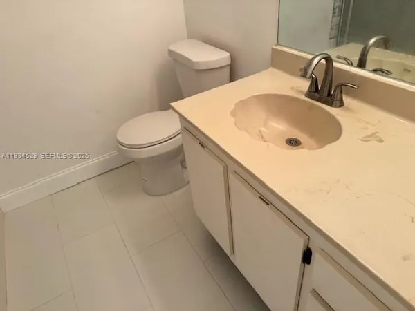 a bathroom with a sink and toilet