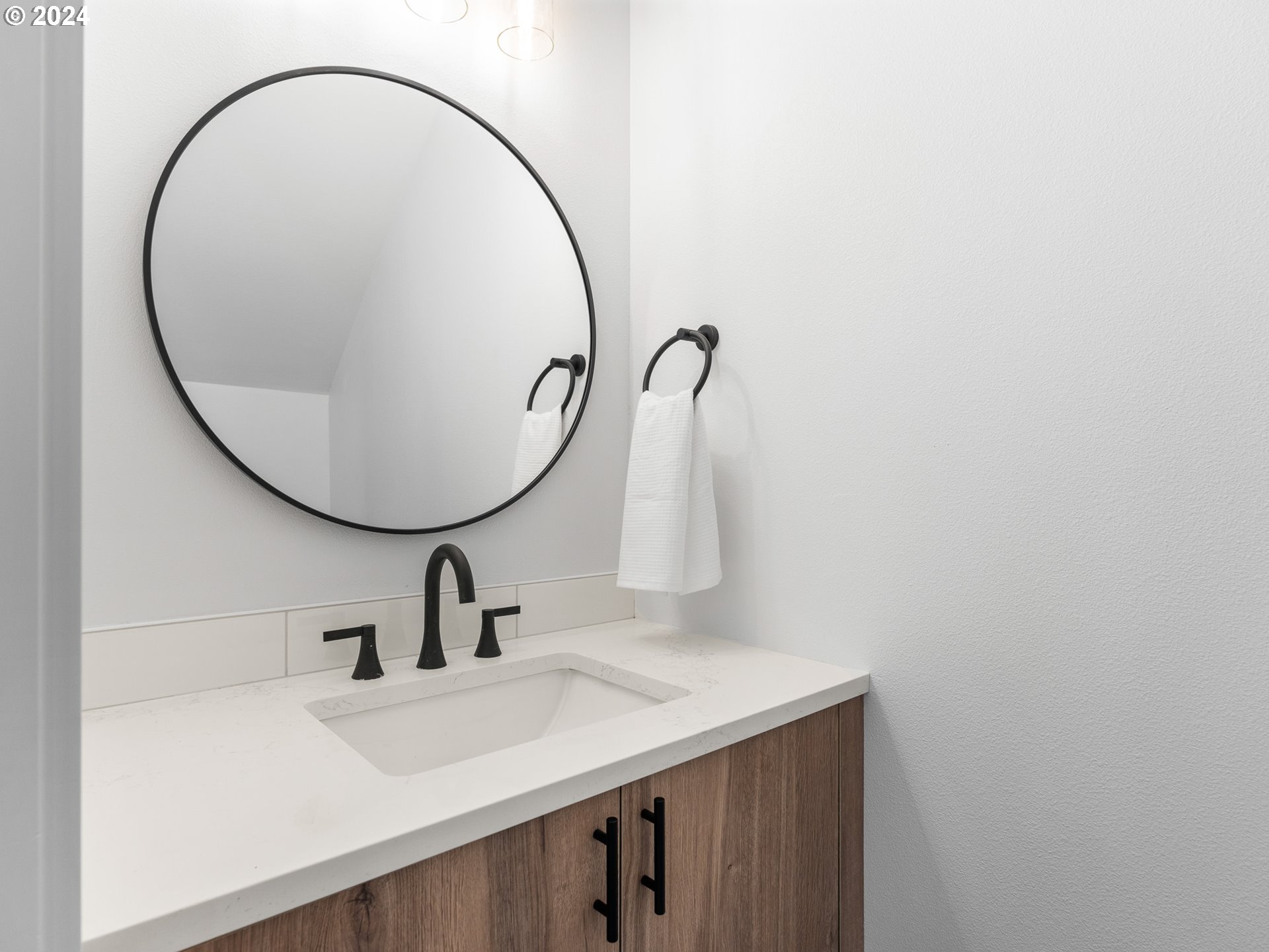 7740 Southeast Long Street, Unit A Portland, OR 97206 - Photo 13 of 23 a bathroom with a sink and a mirror