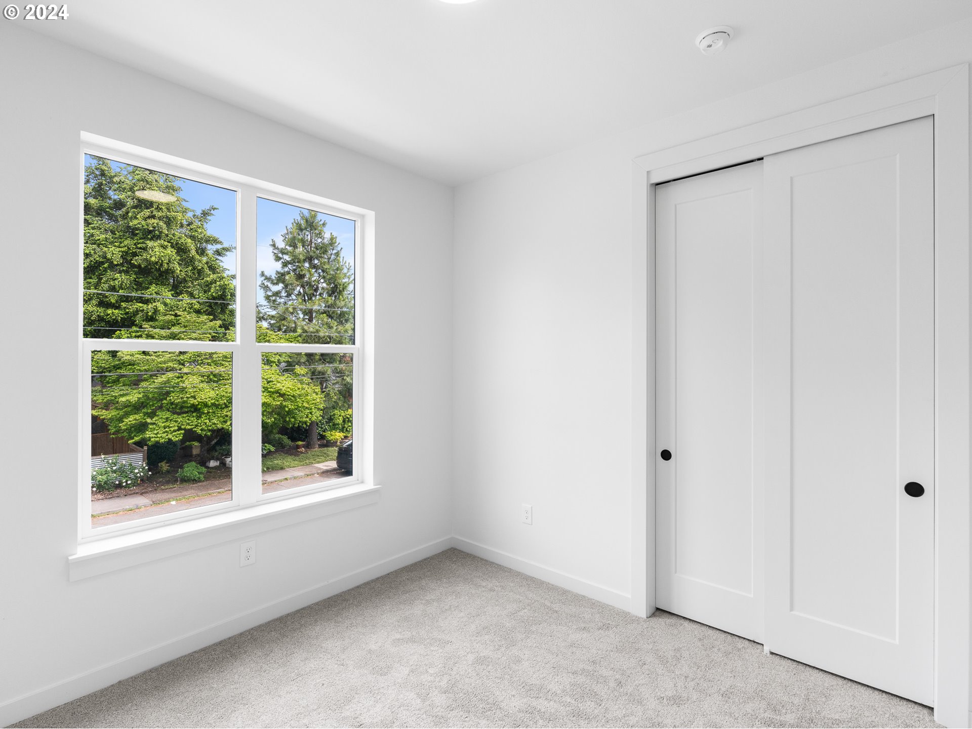 7740 Southeast Long Street, Unit A Portland, OR 97206 - Photo 17 of 23 an empty room with a window