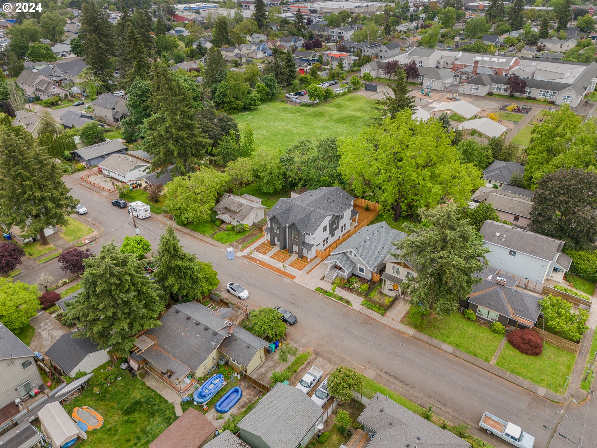 7740 Southeast Long Street, Unit A Portland, OR 97206 - Photo 20 of 23 an aerial view of residential houses with outdoor space