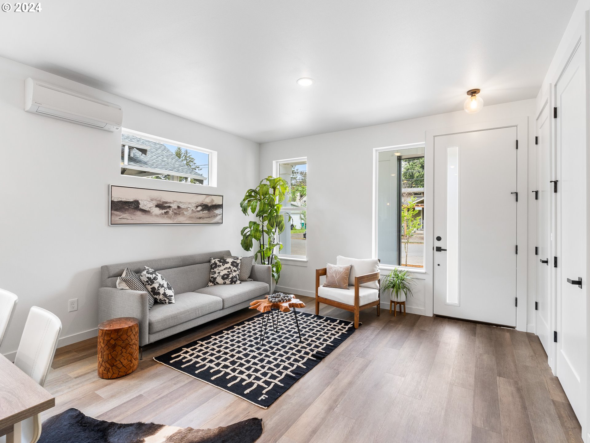 7740 Southeast Long Street, Unit A Portland, OR 97206 - Photo 5 of 23 a living room with furniture and wooden floor