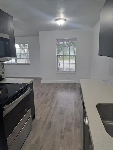 a view of a livingroom with wooden floor