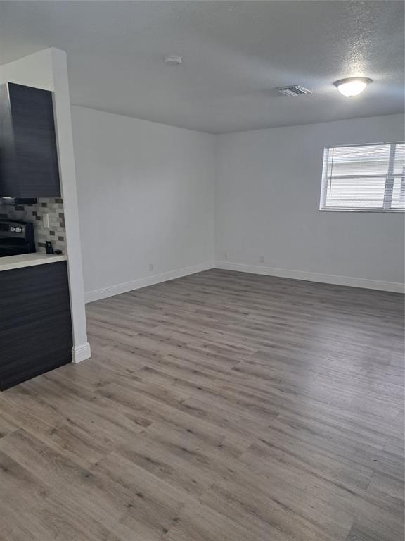 980 Southwest 76th Avenue, Unit 3 Pompano Beach, FL 33068 - Photo 13 of 32 a view of a livingroom with wooden floor