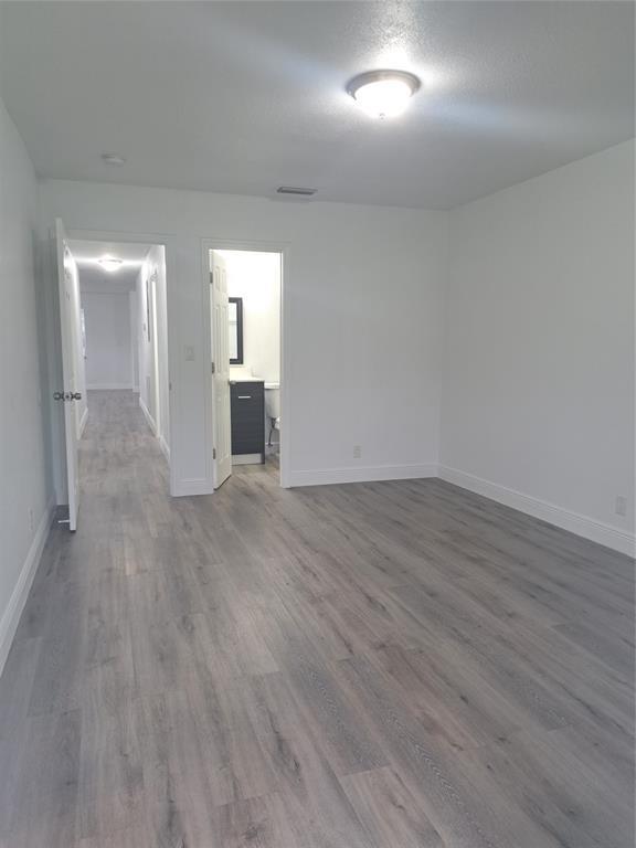 980 Southwest 76th Avenue, Unit 3 Pompano Beach, FL 33068 - Photo 15 of 32 wooden floor in an empty room