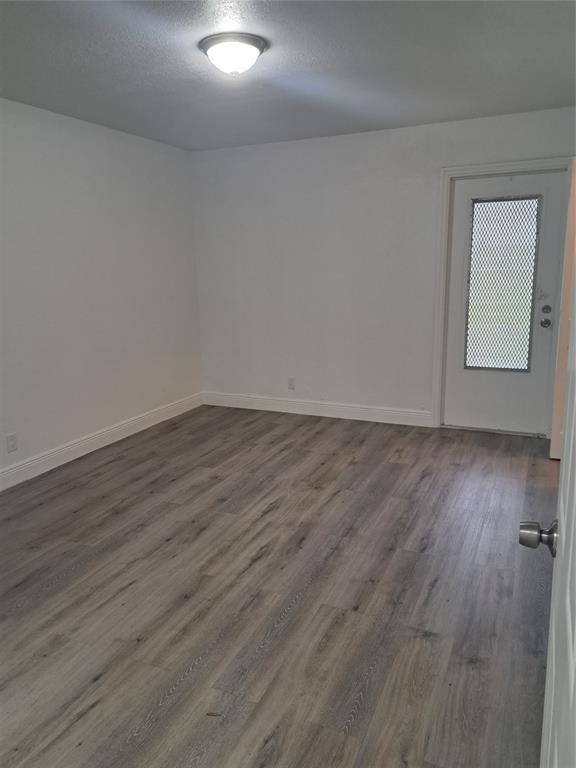 980 Southwest 76th Avenue, Unit 3 Pompano Beach, FL 33068 - Photo 16 of 32 wooden floor in a empty room
