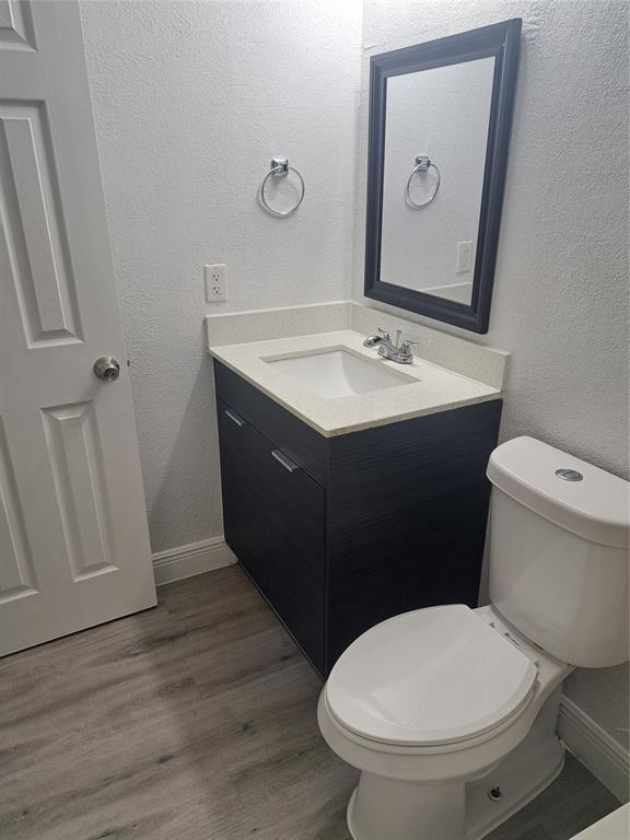 980 Southwest 76th Avenue, Unit 3 Pompano Beach, FL 33068 - Photo 18 of 32 a bathroom with a sink and a toilet