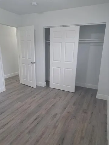 a bathroom with a sink vanity and a toilet