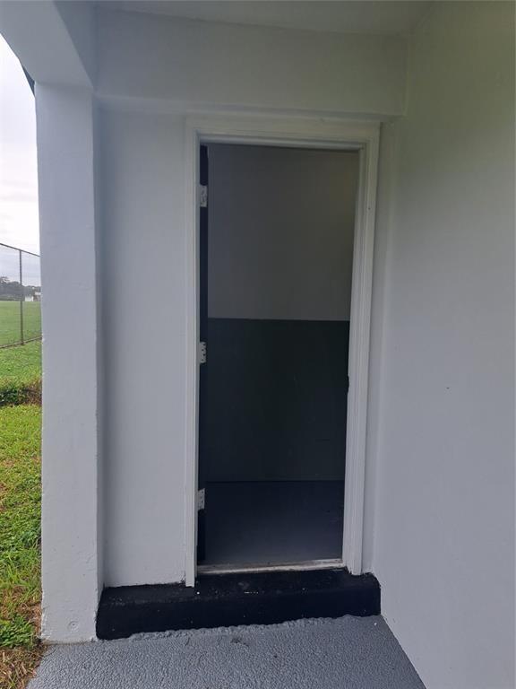 980 Southwest 76th Avenue, Unit 3 Pompano Beach, FL 33068 - Photo 28 of 32 a view of wooden door