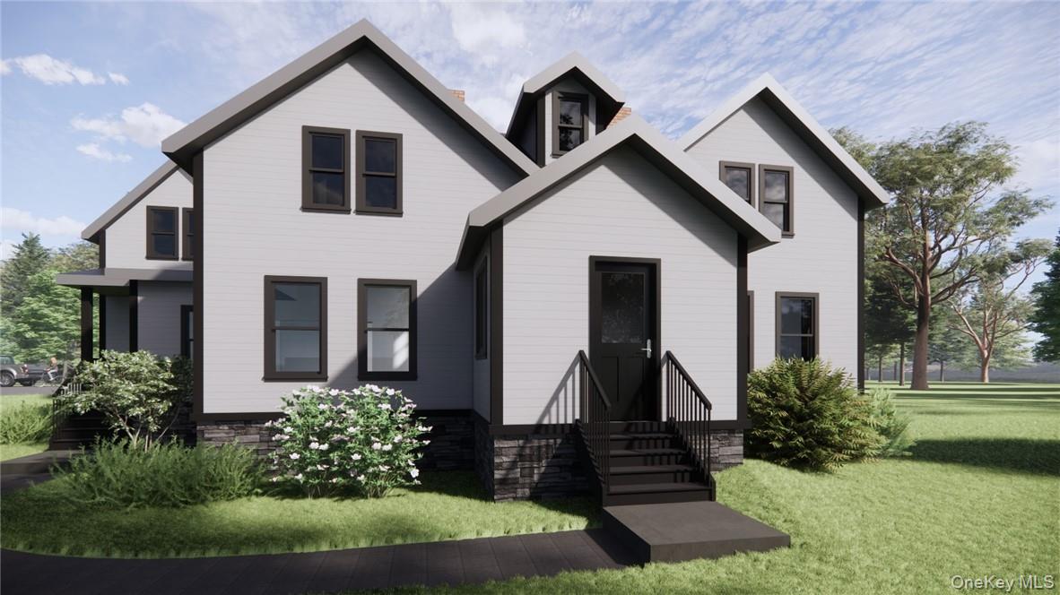 View of front facade with a front yard