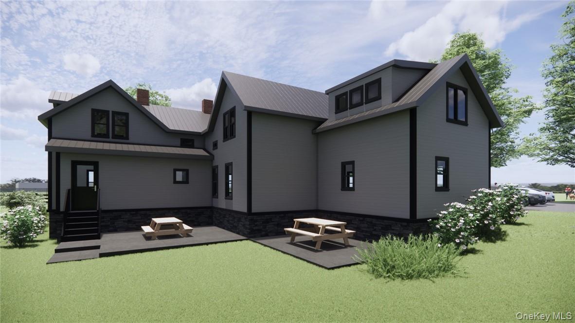 165 South Cross Road, Unit 4 Staatsburg, NY 12580 - Photo 2 of 12 View of Back of house featuring a patio area and a lawn