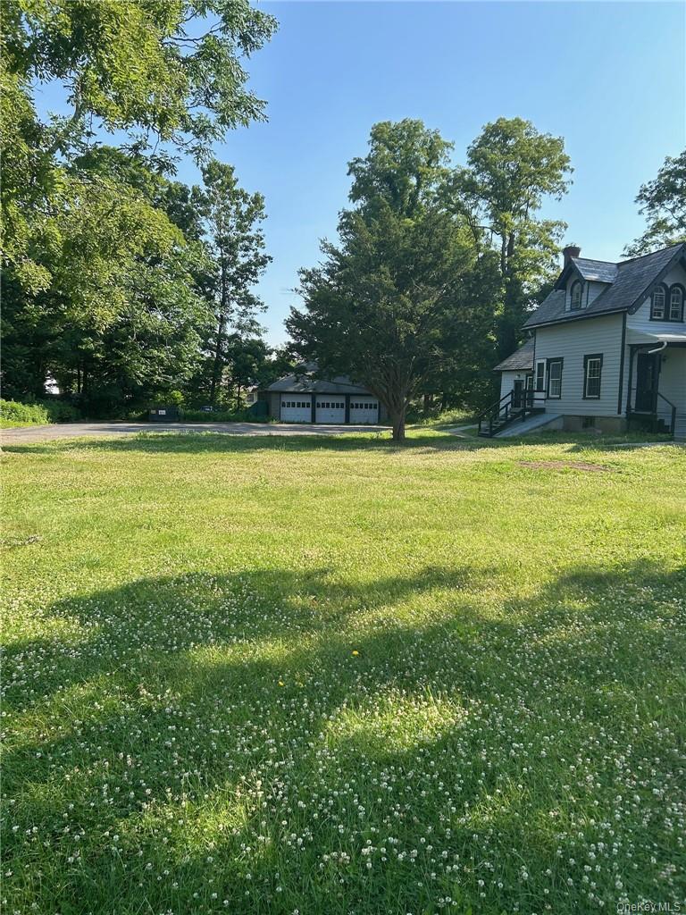165 South Cross Road, Unit 4 Staatsburg, NY 12580 - Photo 10 of 12 View of yard with a garage