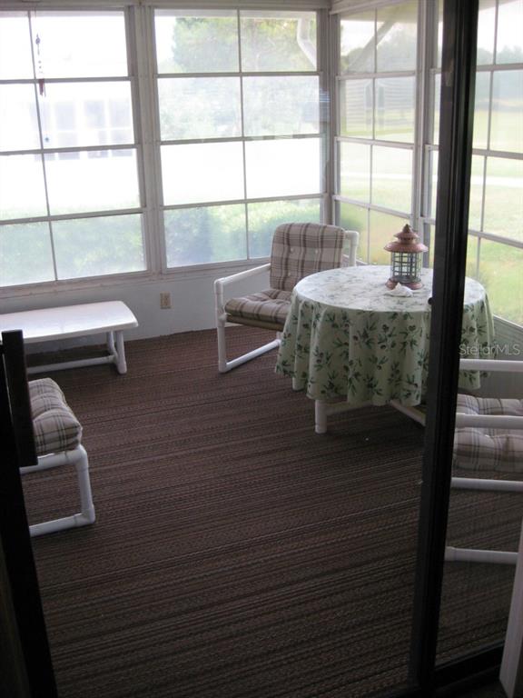 2526 Putter Road, Unit 601 Zellwood, FL 32798 - Photo 7 of 16 ENCLOSED PORCH OFF OF KITCHEN/DINING AREA