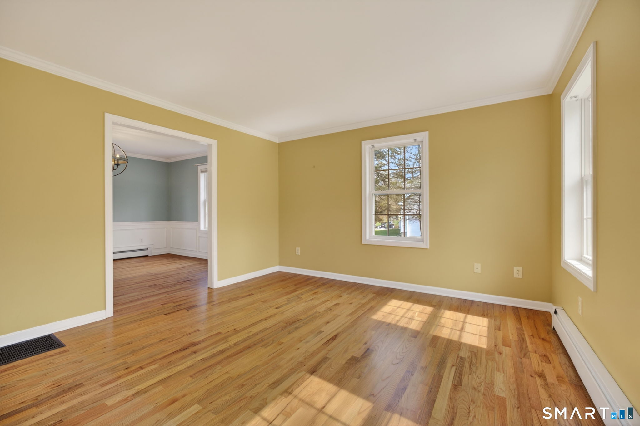 12 Stonewall Lane Clinton, CT 06413 - Photo 12 of 32 a view of an empty room with wooden floor and a window