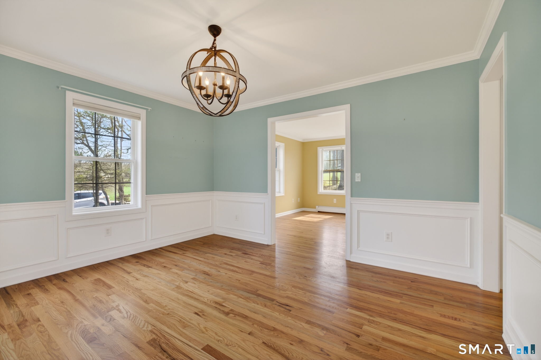 12 Stonewall Lane Clinton, CT 06413 - Photo 14 of 32 an empty room with wooden floor and windows