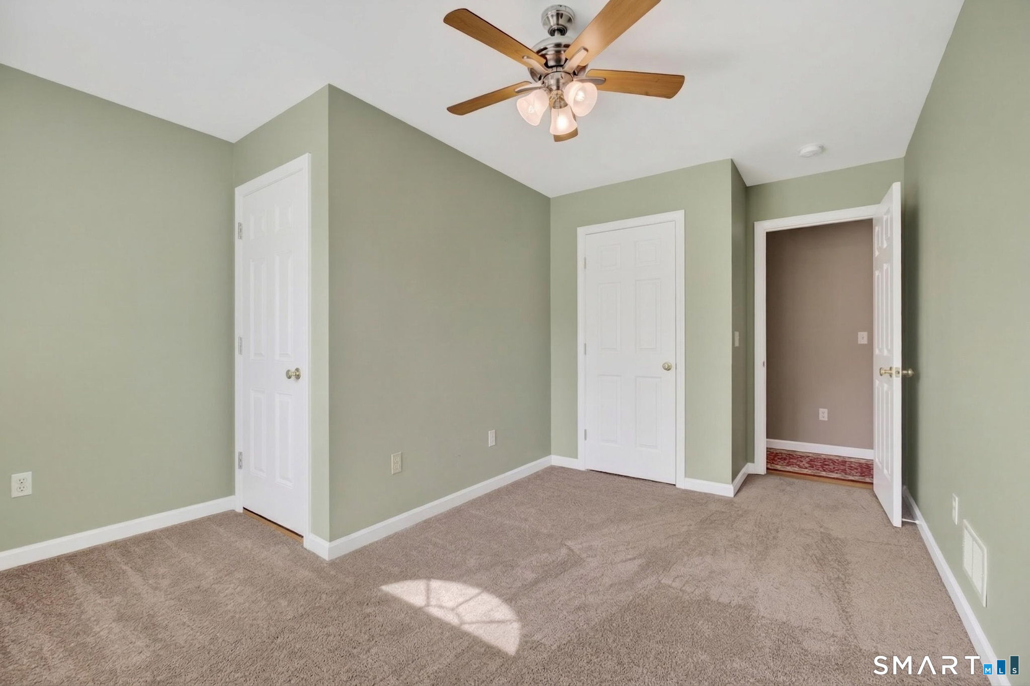 12 Stonewall Lane Clinton, CT 06413 - Photo 24 of 32 a view of an empty room with chandelier fan